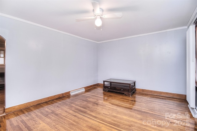 unfurnished room featuring ceiling fan, ornamental molding, and wood-type flooring