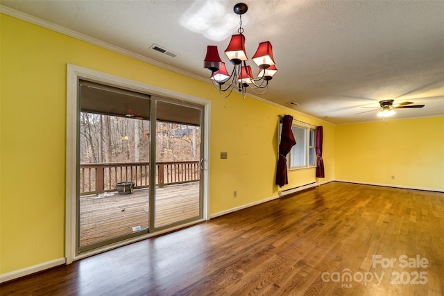 spare room with crown molding, a baseboard radiator, and wood-type flooring