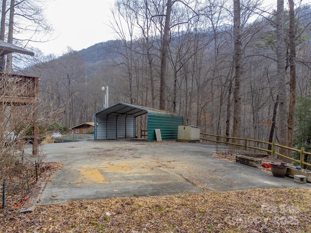 exterior space featuring a carport and a mountain view