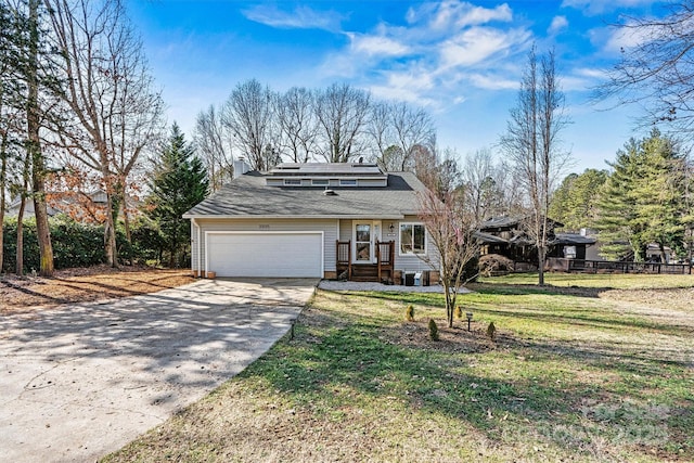 view of front facade featuring a garage and a front yard