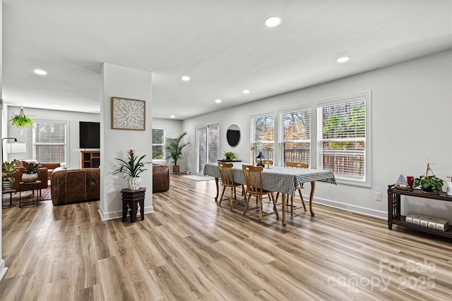 dining area featuring light wood-type flooring