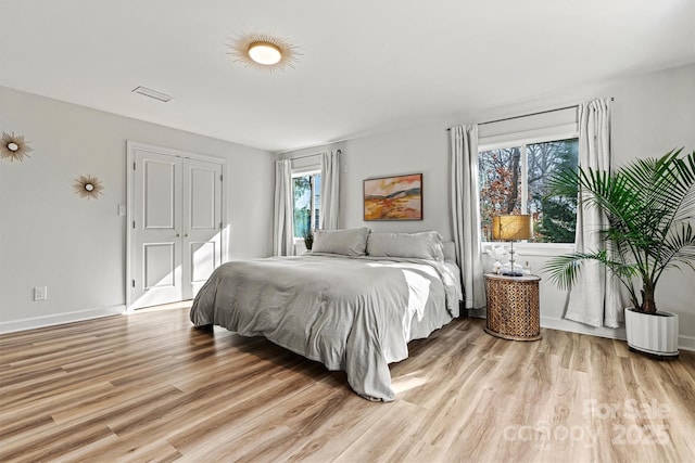 bedroom with light hardwood / wood-style floors