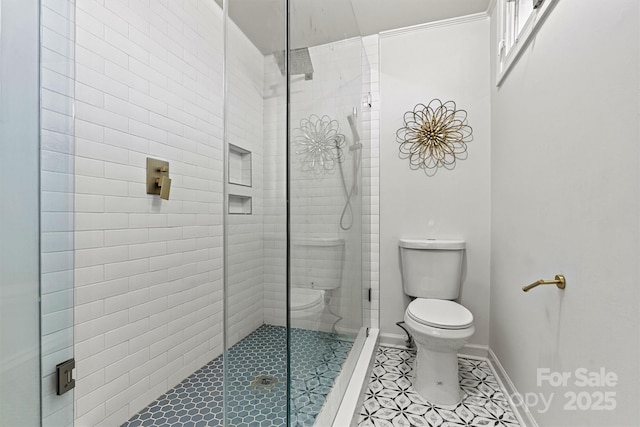 bathroom with toilet and an enclosed shower