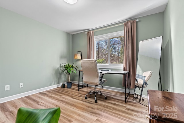 office area with light hardwood / wood-style floors