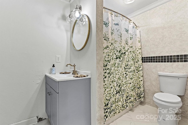 bathroom with tile walls, vanity, toilet, crown molding, and a shower with shower curtain