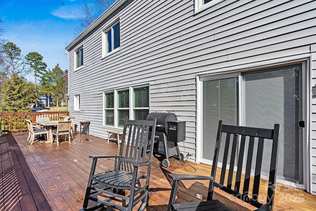 wooden deck featuring area for grilling