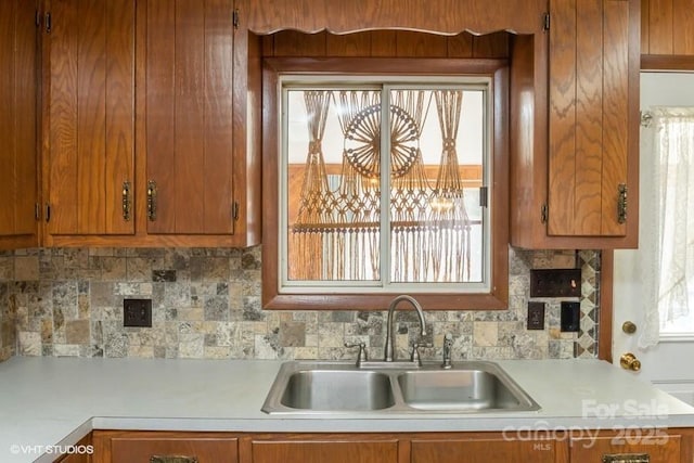 kitchen with sink and backsplash