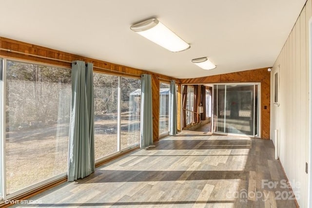 unfurnished sunroom with a wealth of natural light