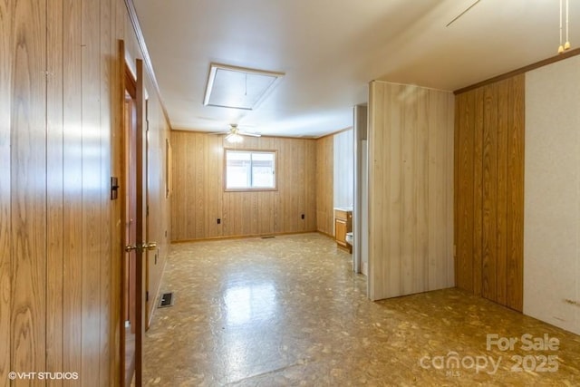 bonus room with wood walls