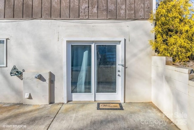 doorway to property with a patio area