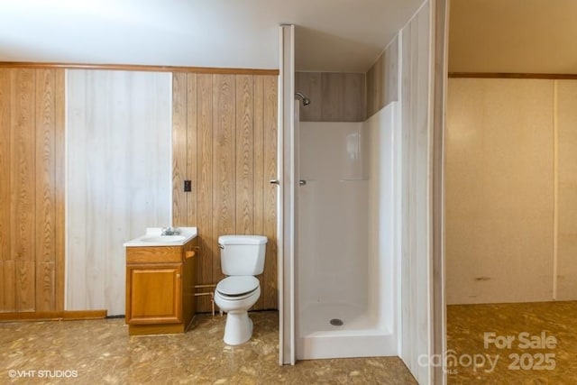 bathroom with vanity, toilet, and walk in shower