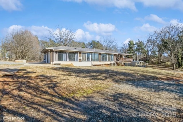 view of front of property with a sunroom