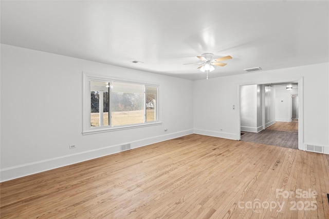 unfurnished living room featuring ceiling fan and light wood-type flooring