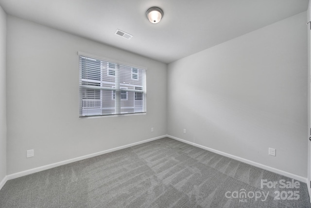 unfurnished room featuring carpet