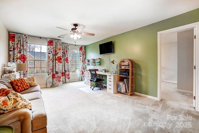 home office with ceiling fan, carpet floors, and baseboards