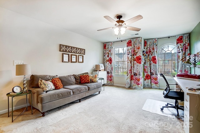 office space featuring ceiling fan, carpet, visible vents, and baseboards