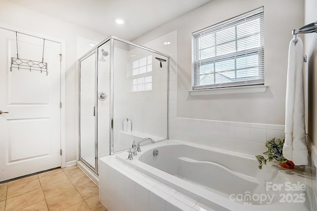 full bath with a stall shower, a bath, and tile patterned floors