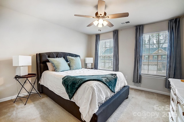 bedroom with light carpet, baseboards, visible vents, and ceiling fan