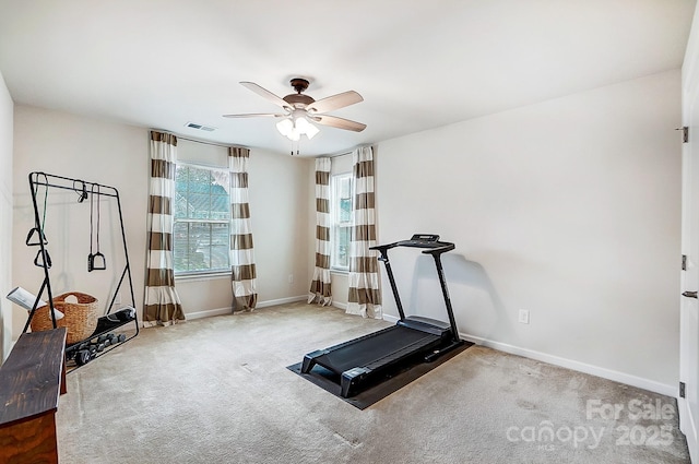 exercise room with ceiling fan, carpet floors, visible vents, and baseboards