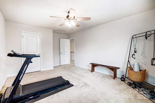 exercise room with ceiling fan, carpet flooring, attic access, and baseboards