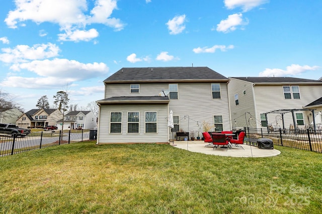 back of house with a fenced backyard, a residential view, a lawn, and a patio