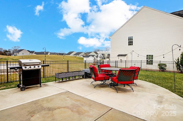 view of patio / terrace with outdoor dining space, a fenced backyard, and a grill