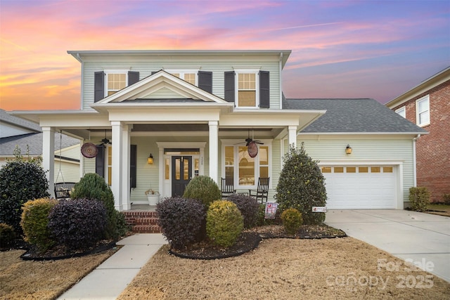 front facade with a garage and a porch