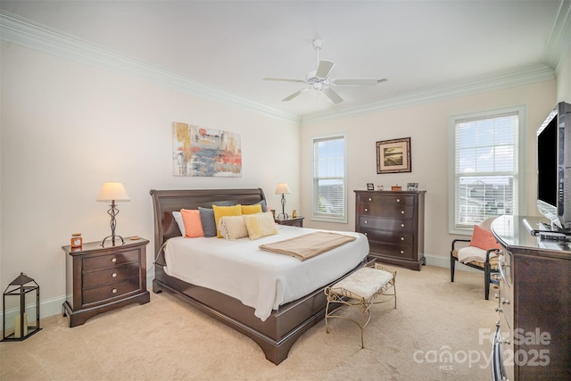 carpeted bedroom featuring crown molding and ceiling fan