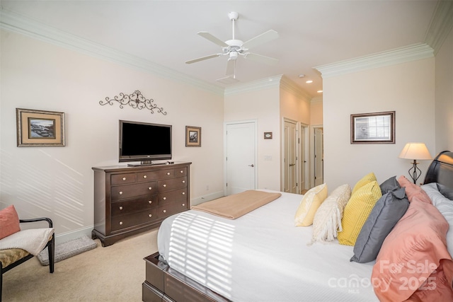 bedroom featuring ornamental molding, light colored carpet, and ceiling fan