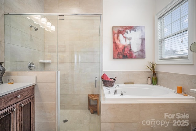 bathroom featuring shower with separate bathtub