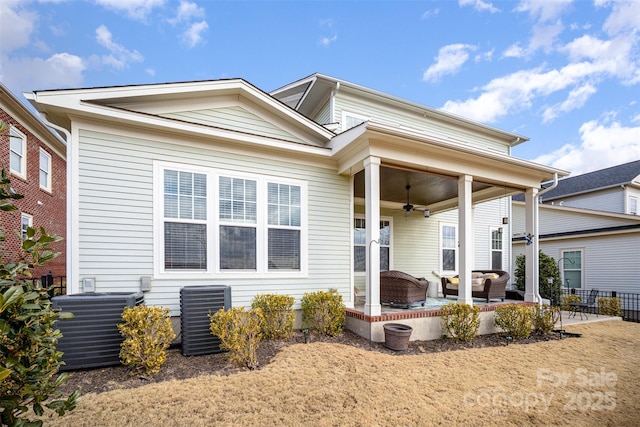 view of front of property with ceiling fan and central air condition unit