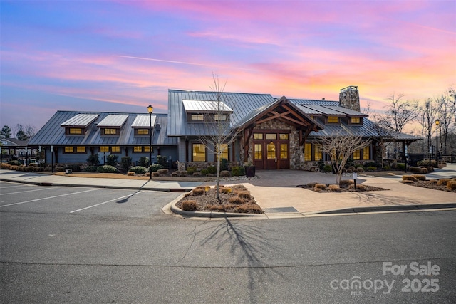 view of outdoor building at dusk