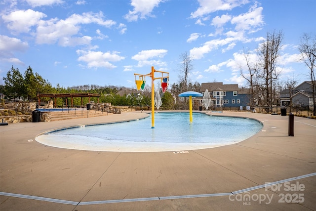 view of pool featuring a pergola and a patio area