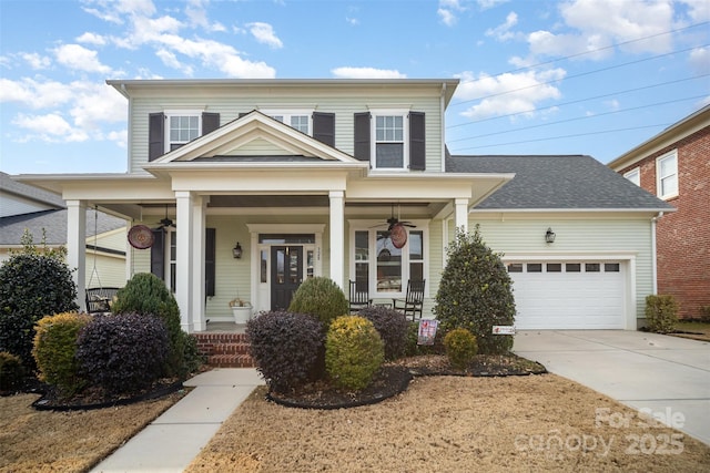 traditional-style home featuring a porch, concrete driveway, a shingled roof, a garage, and ceiling fan