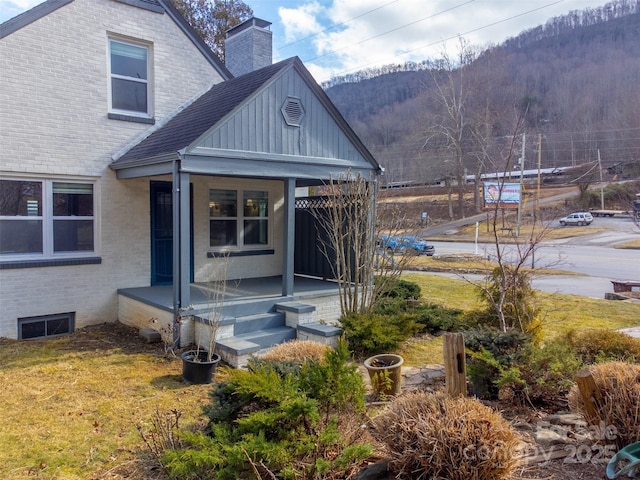 back of house with a mountain view