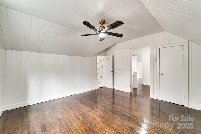 additional living space featuring ceiling fan, lofted ceiling, and dark hardwood / wood-style floors