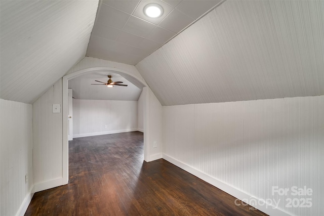 bonus room with ceiling fan, lofted ceiling, and dark hardwood / wood-style floors