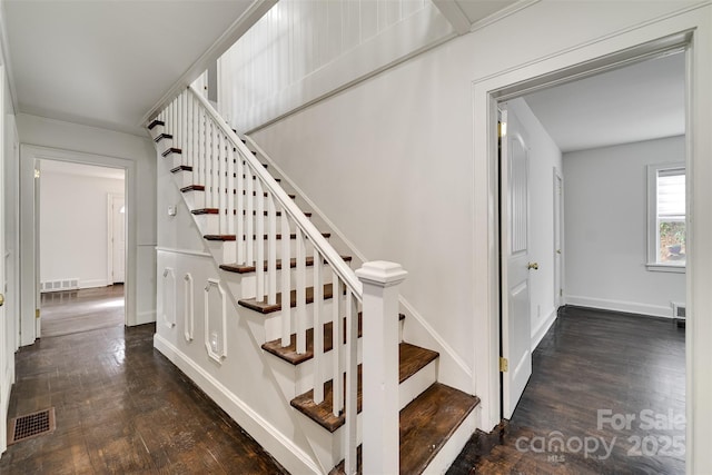 stairs with hardwood / wood-style floors