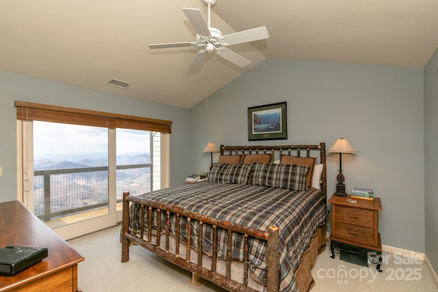 carpeted bedroom featuring lofted ceiling, a mountain view, ceiling fan, and access to exterior