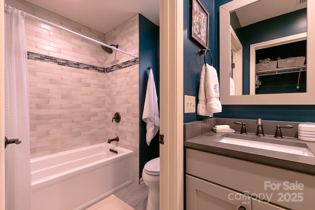 full bathroom with shower / bathtub combination with curtain, vanity, and toilet