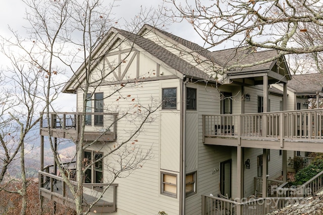 view of side of home featuring a balcony