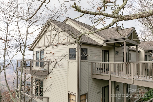 view of home's exterior with a balcony