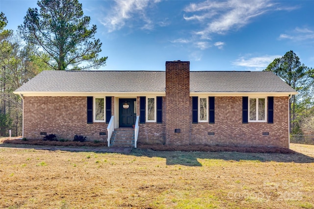 ranch-style house with brick siding, roof with shingles, a chimney, crawl space, and a front lawn