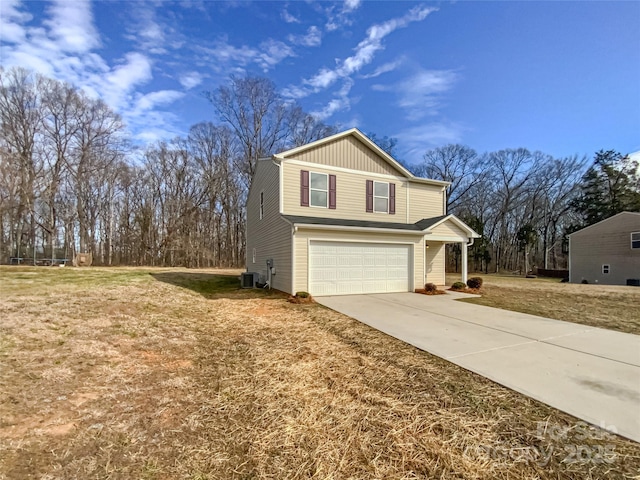 exterior space with a garage, central AC, and a front lawn