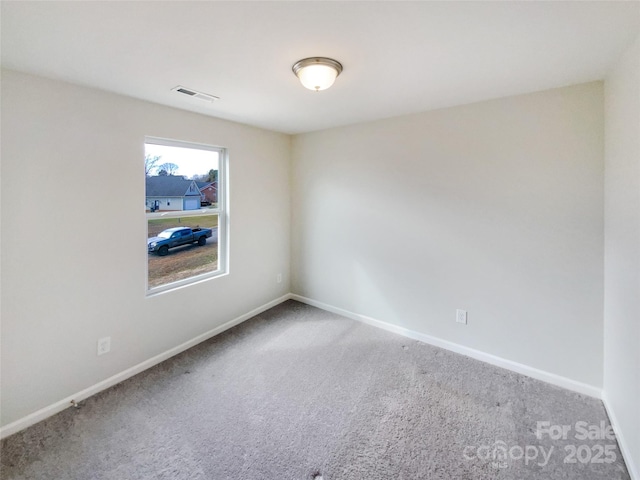 spare room with carpet flooring