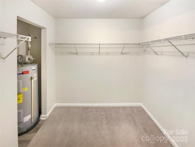 spacious closet featuring water heater