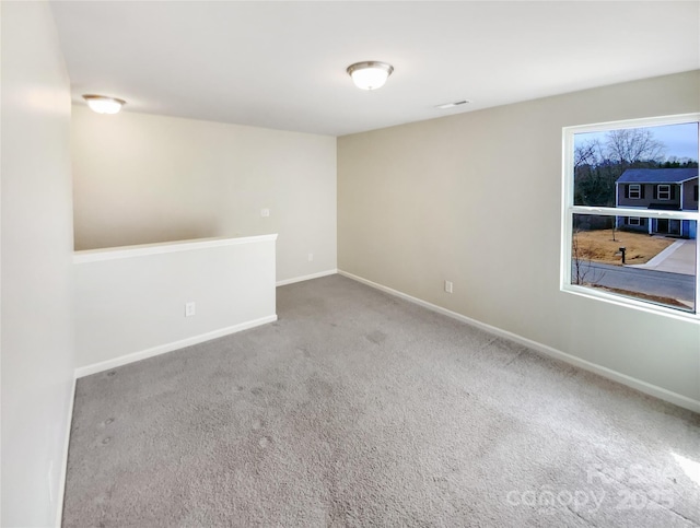 empty room featuring carpet flooring