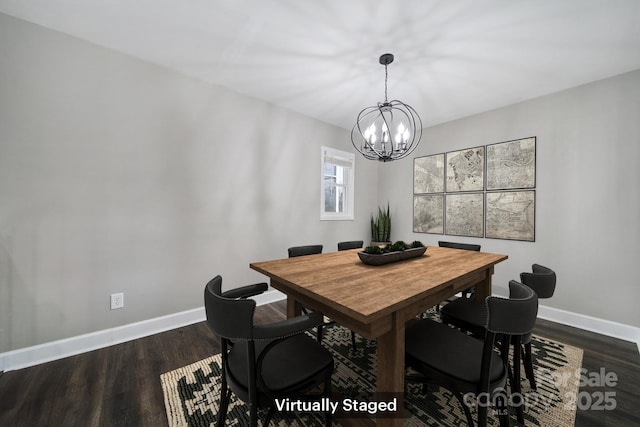 dining space with a notable chandelier and dark hardwood / wood-style floors