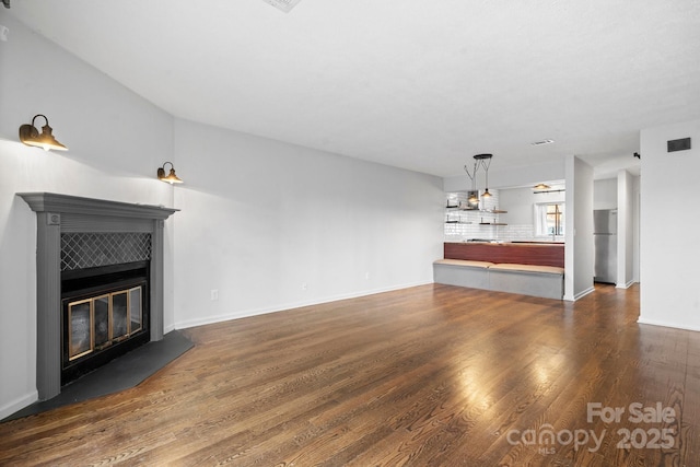 505 Victory Trl, Morganton, NC 28655 - unfurnished living room with visible vents, baseboards, wood finished floors, and a tile fireplace