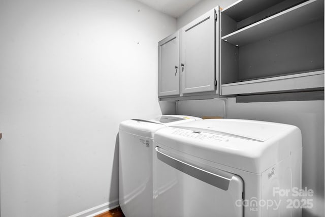 505 Victory Trl, Morganton, NC 28655 - clothes washing area with independent washer and dryer, baseboards, and cabinet space